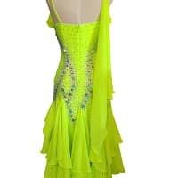 Back view of Electric Citrine ballroom gown with layered chiffon godets and elegant drape