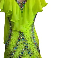 Close-up detail of rhinestones and iridescent crystals on Electric Citrine ballroom gown bodice