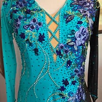 Electric Bloom ballroom dress close-up of front design with crystal embellishments and cutout detail