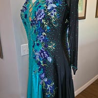 Electric Bloom ballroom dress side view with sheer black sleeve and floral crystal design