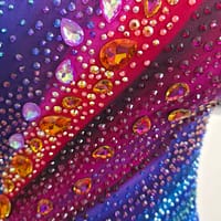Chromatic Fire Latin dress close-up of colorful crystals and rhinestone embellishments