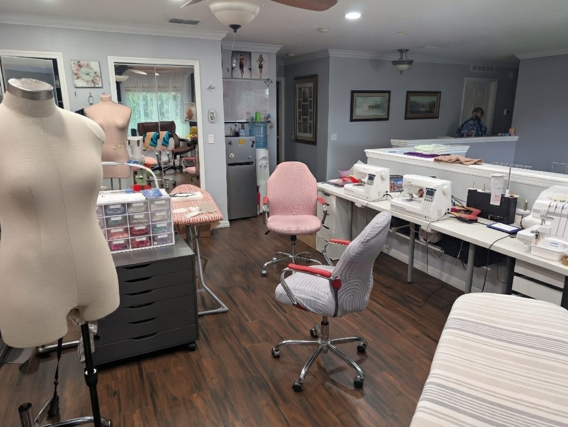 Cashay Ballroom studio interior with gown portfolio gallery and fabric storage.