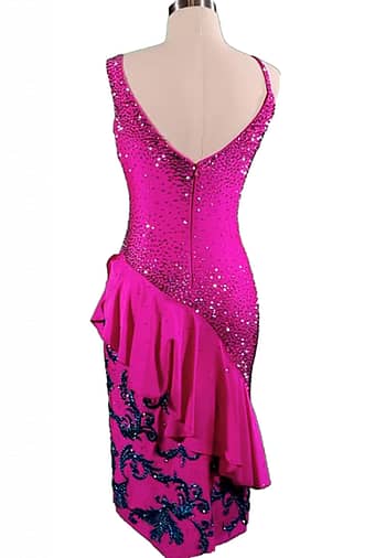 Nuna Latin dress — back view — deep V-back with crystal snowfall pattern and embroidered blue accents