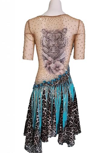 Tiger Latin Dress — back view — mannequin displaying a striking tiger head tattoo appliqué on sheer nude mesh and asymmetric skirt