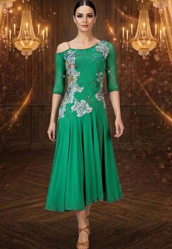 Emerald Motion Latin dress — front view — Bright emerald green Latin dress with three-quarter length sheer sleeves, an off-the-shoulder strap detail, and a heavily stoned bodice with flowing white and blue floral appliqués.