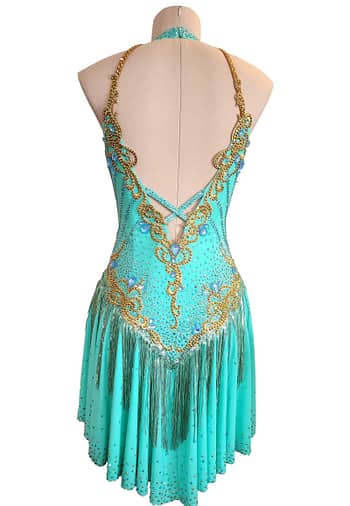 Ashcroft Latin dress - back view - Teal fabric, gold appliqué, open V-back, and fringe skirt.