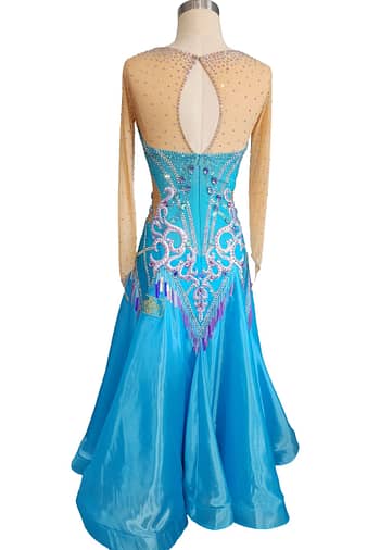 Jackie ballroom gown — back view — blue dress with a keyhole back opening and elaborate white, purple, and iridescent crystal stoning on the fitted bodice.