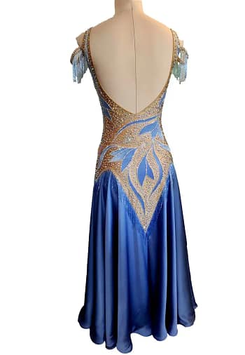 Back view of the Blue Silhouette Atelier ballroom gown featuring an open scoop back, crystal-trimmed neckline, and elegant sky blue ballroom skirt.