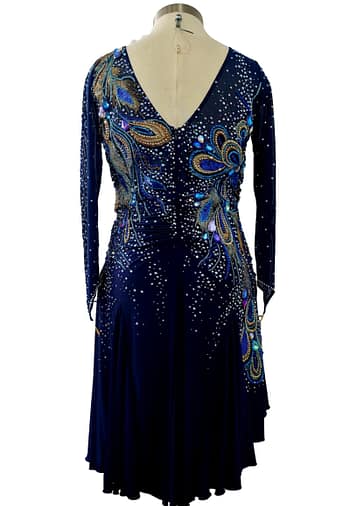 Full back view of Cato navy ballroom dress with deep V back, crystal embellishment, and flowing skirt