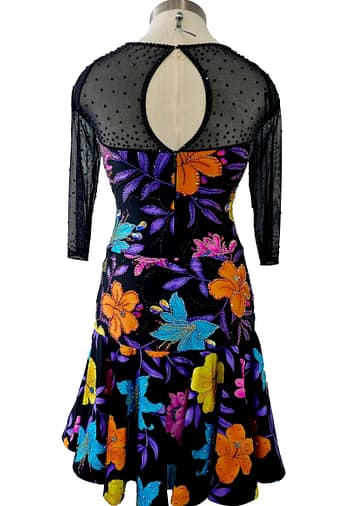 Front view — black base with multicolor floral appliqués and sheer mesh neckline