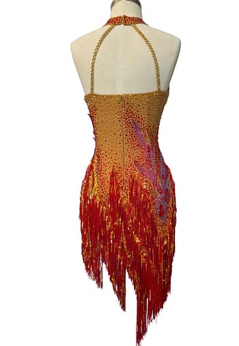 Back view of the Inferno Cascade dress featuring an open-back design with delicate straps and a gradient of red and gold crystals.