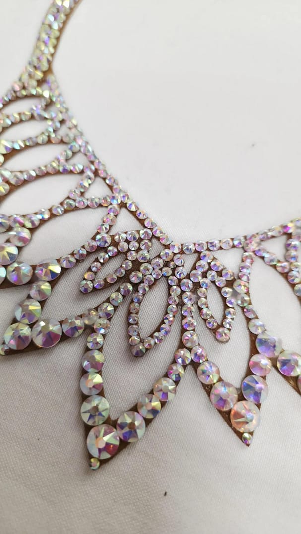 Close-up of Crystal AB stones on Aurora ballroom necklace with clear color and high-reflection shine.