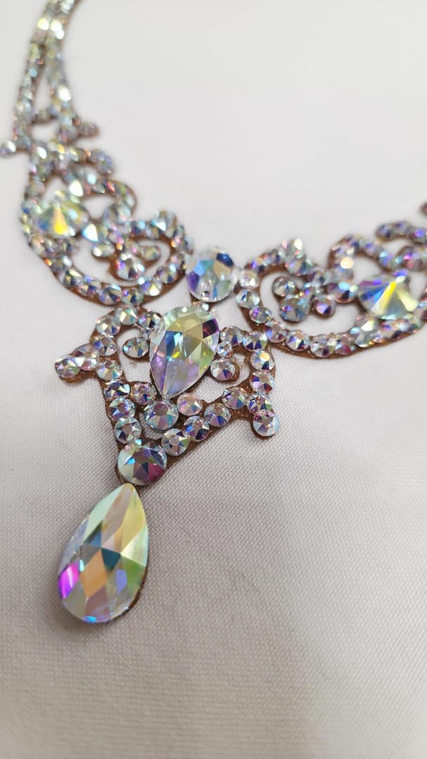 Close-up of Crystal AB stones on a handmade ballroom necklace with high-reflection sparkle.