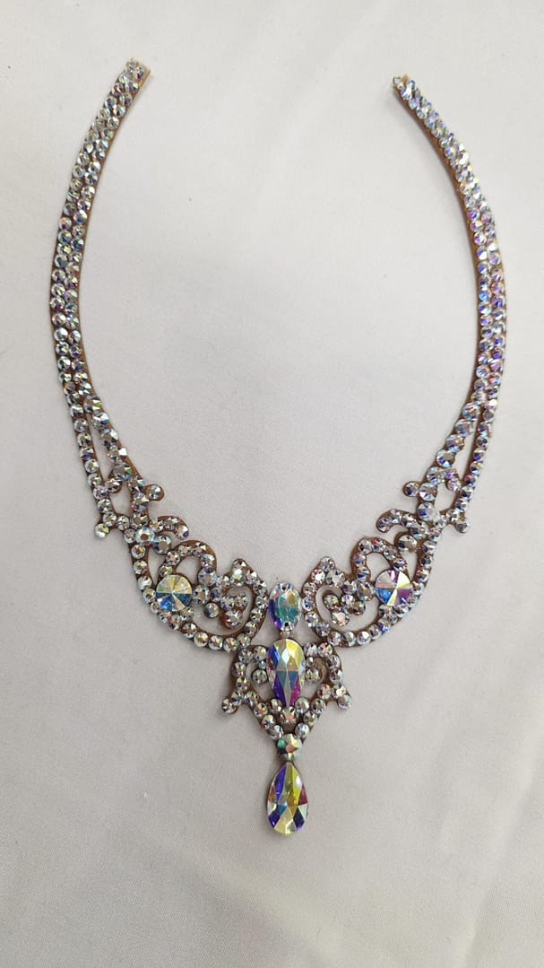 Full design view of crystal ballroom necklace featuring ornate crystal arrangement and teardrop center stone.