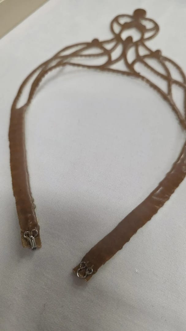 Back view of ballroom necklace showing silicone backing and secure closure for dancing