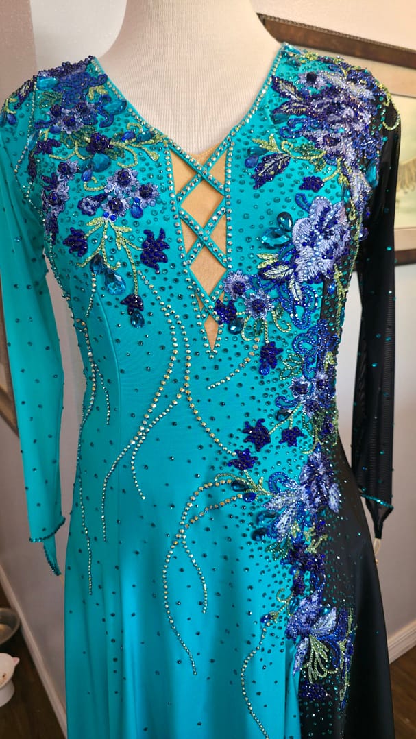 Electric Bloom ballroom dress bodice detail with blue floral appliqué and rhinestone crystals