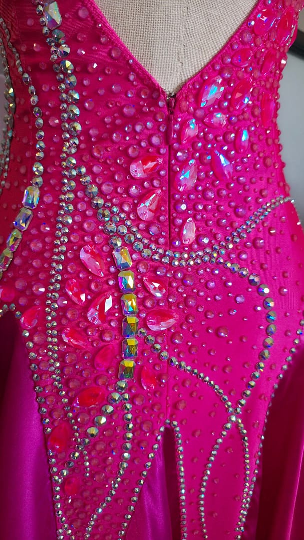 Back detail of Malibu Dream ballroom gown showing zipper and rhinestone embellishments