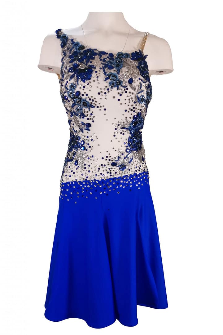 Manon Latin dress — stonework close‑up — dense arrangement of blue and clear crystals in various sizes