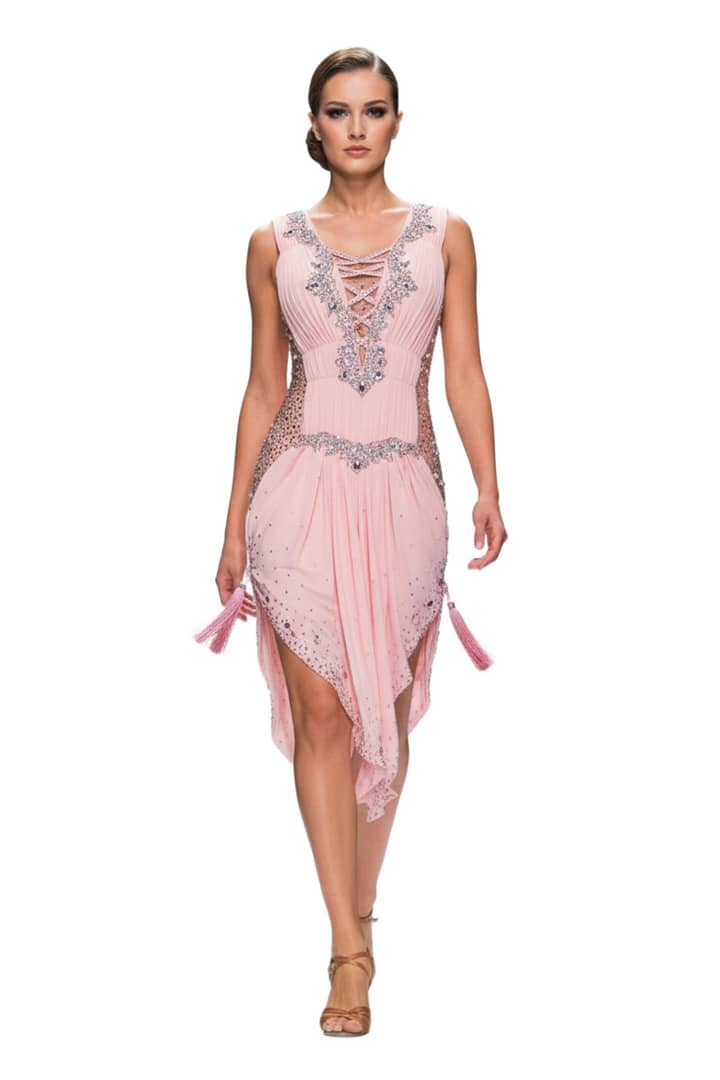 Joni Latin dress — front view — pleated peach fabric with lace-up plunge, crystal accents, and tassels