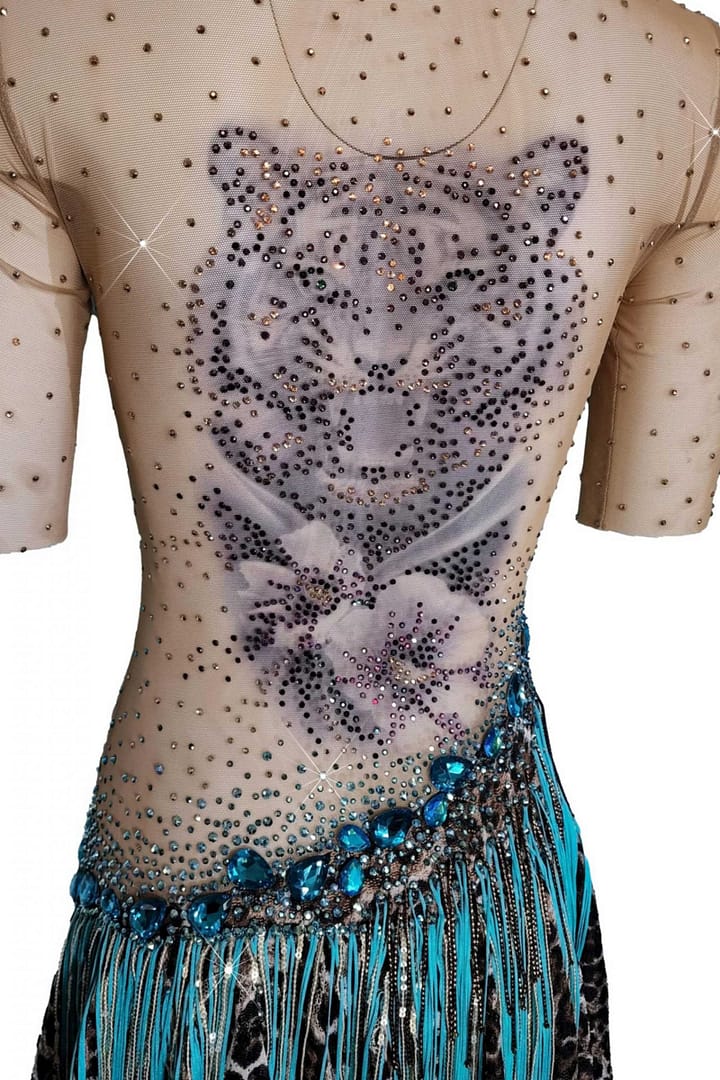 Tiger Latin Dress — back detail — close-up of the tiger head tattoo on nude mesh, accented by turquoise and brown crystal stoning
