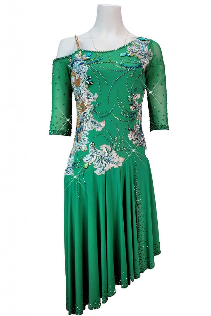 Carmen Latin dress — bodice detail — Close-up showing white and light blue floral appliqués surrounded by small crystals, creating a delicate yet elaborate pattern over the sheer green mesh bodice.