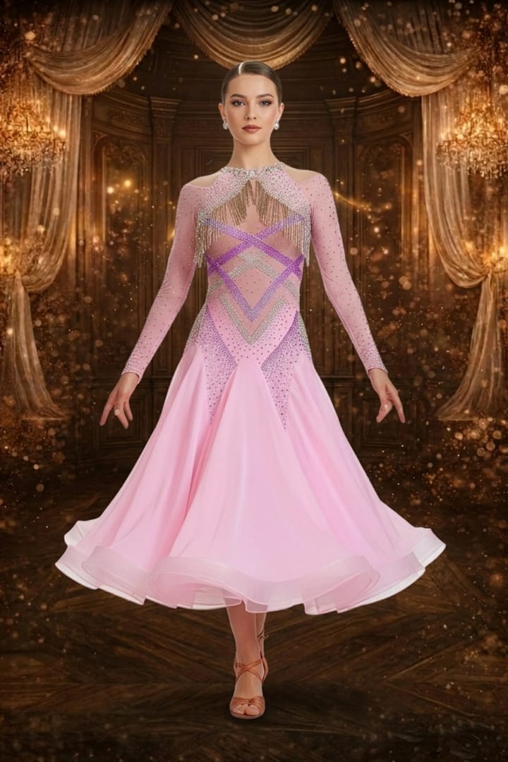 Blush Momentum ballroom gown — front view — Long-sleeved, pale pink Standard gown with a sheer mesh yoke, detailed geometric stoning in purple and AB crystals, and silver beaded fringe across the chest and shoulders.