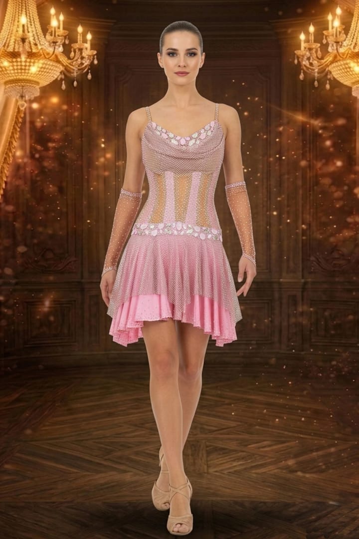Blush Reverie Latin dress front view — blush pink gown with crystal mesh overlay and intricate rhinestone patterns.