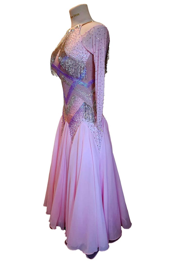Labana ballroom gown — 3/4 view — Full-length, voluminous skirt in layered pink chiffon/organza, a fitted bodice with criss-cross crystal patterns, and cold-shoulder long sleeves.