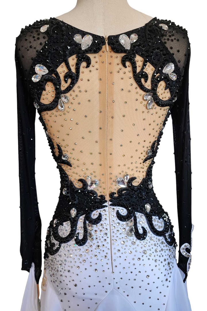 Lauren ballroom gown — back closure detail — close-up of the deep open-back design, featuring a secure zipper closure hidden beneath the black crystal appliqué along the center line.