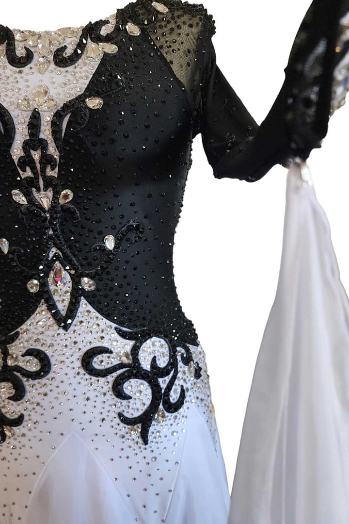 Lauren ballroom gown — stonework close-up — Extreme close-up of the bodice detailing, highlighting the dense black crystals on the velvet and the large clear teardrop crystals outlining the black scroll patterns.