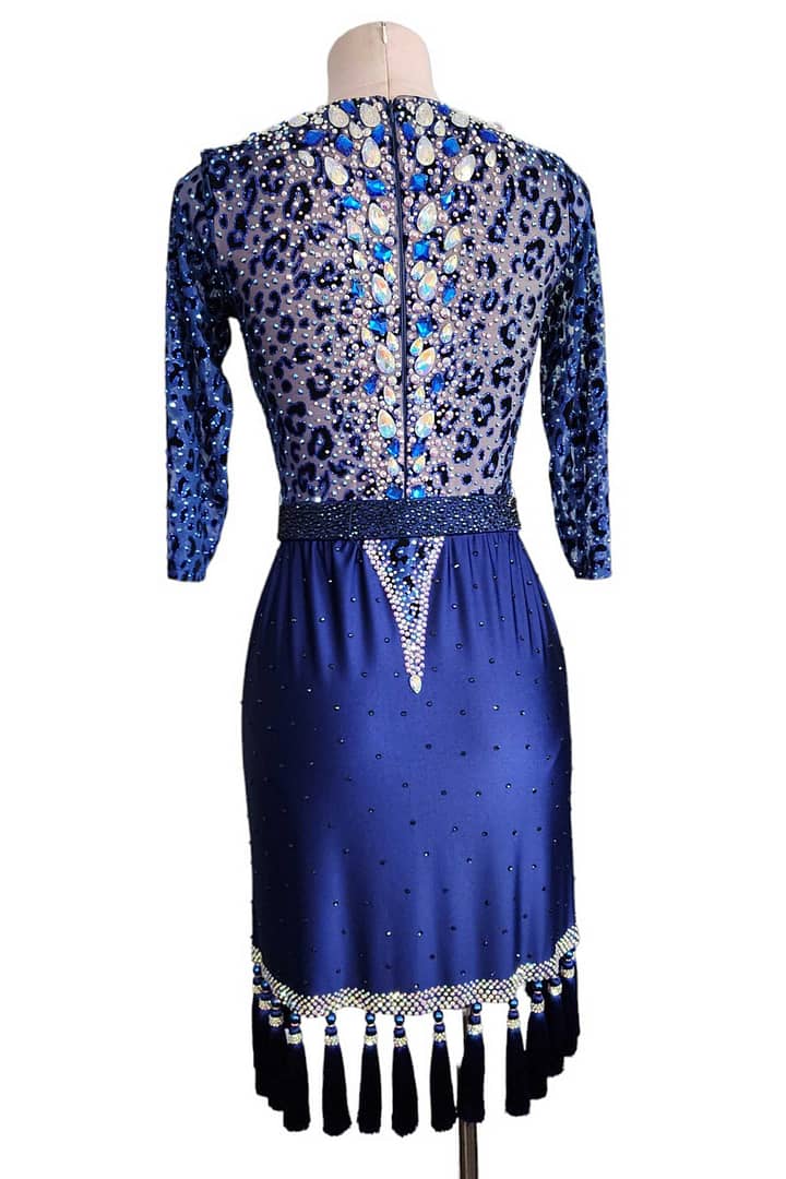 Pala Latin Dress — back view — High-neck back bodice featuring the blue leopard print and a dramatic vertical line of large, assorted blue and AB teardrop crystals down the spine.