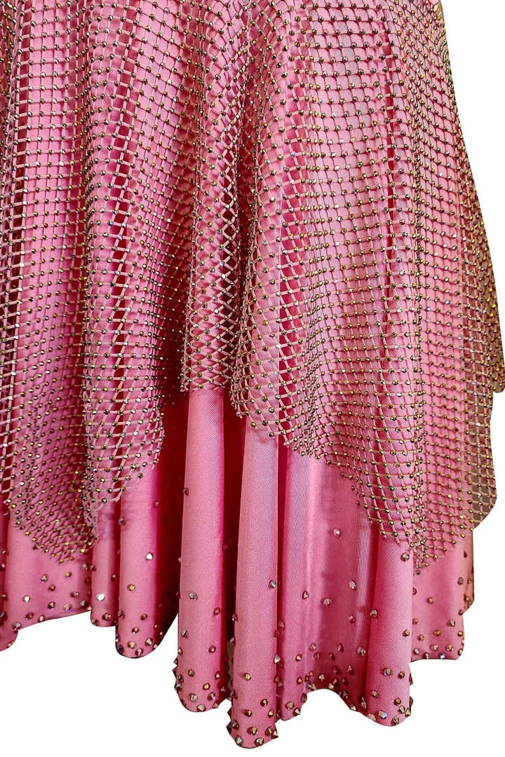Seraphina Latin dress — skirt detail — blush pink double-layered skirt with crystal mesh overlay and scattered rhinestones at the hem.