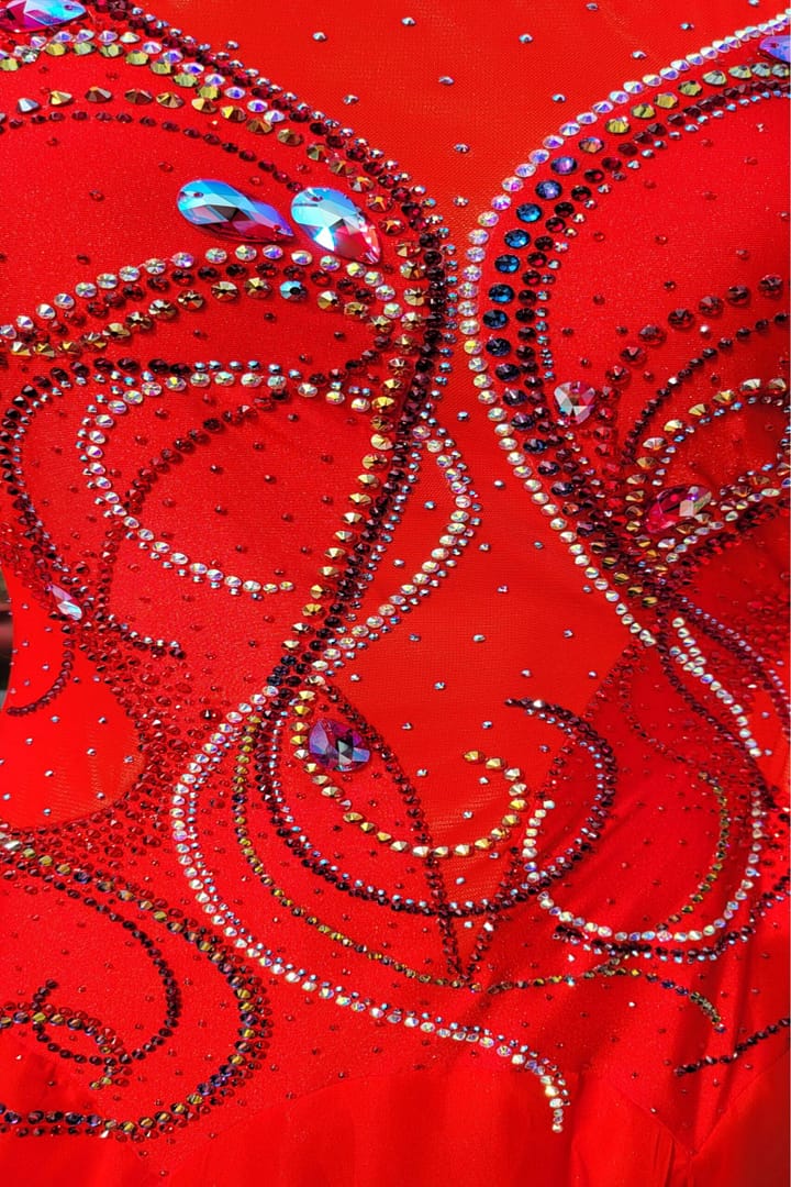 Kalaida ballroom gown — bodice detail — intricate red and AB crystal stonework