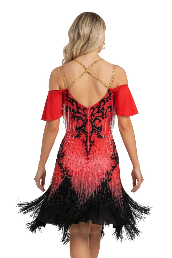 Nyla Latin Dress — back view — red off-shoulder design, criss-cross gold straps, and black swirl appliqué.