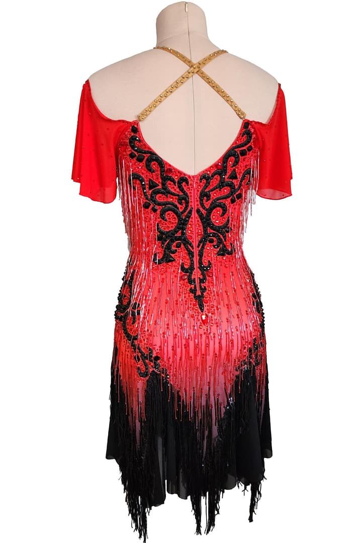 Nyla Latin Dress — back view — red base, open back, gold halter straps, and black embroidered details.