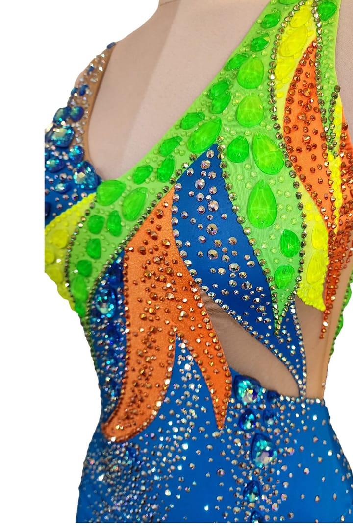 Rio Swirl Latin dress — bodice detail - showing neon yellow crystals against the black appliqué and white stoning swirl.