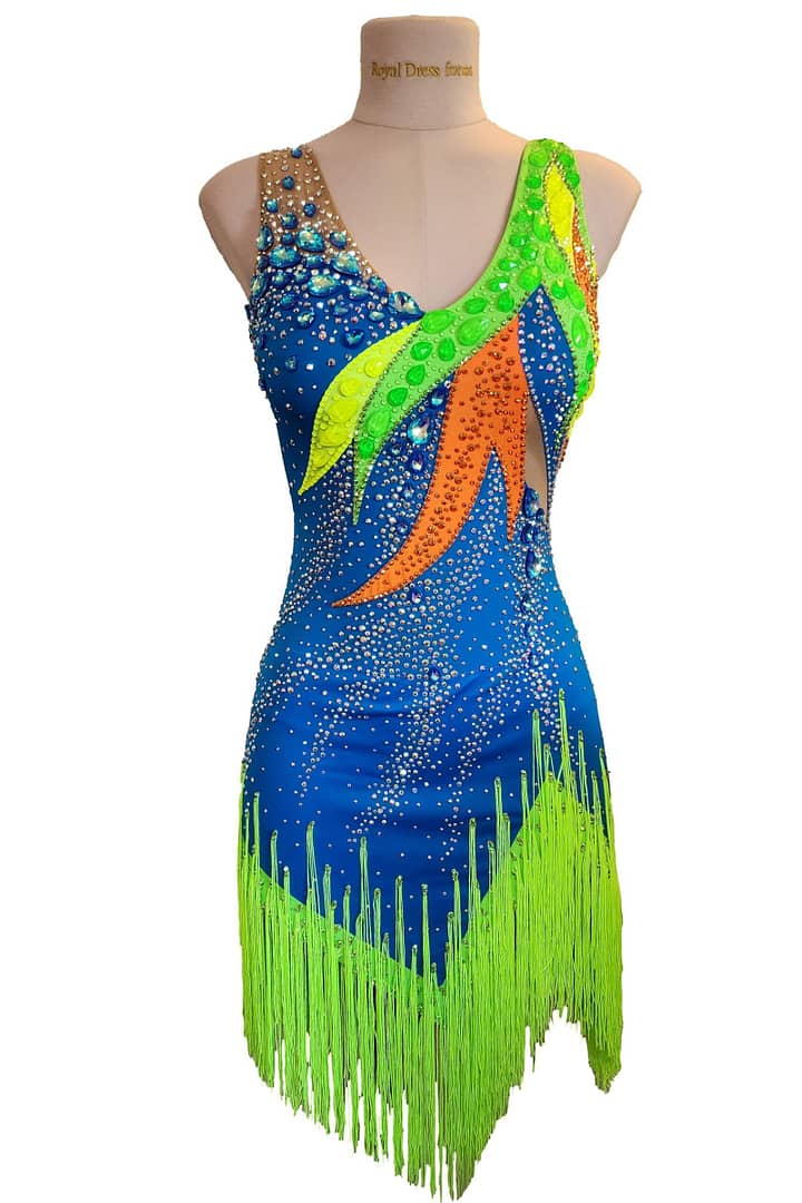 Rio Swirl Latin dress - front view - on mannequin - Black and white geometric design with neon yellow/green crystal accents and asymmetrical fringe.