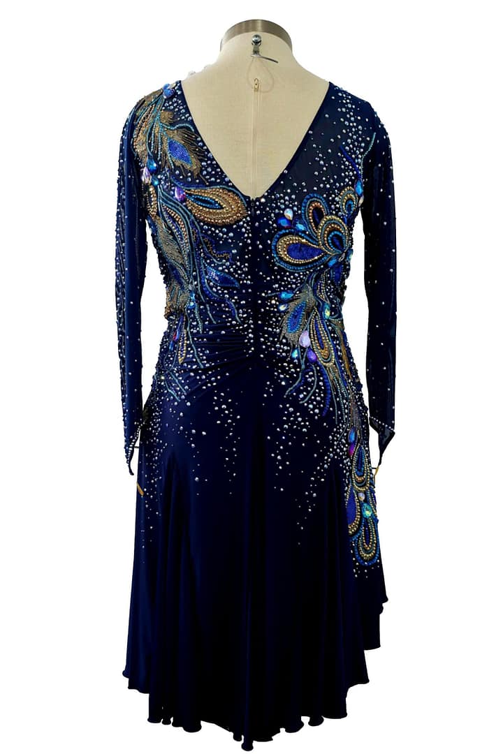 Full back view of Midnight Peacock navy ballroom dress with deep V back, crystal embellishment, and flowing skirt