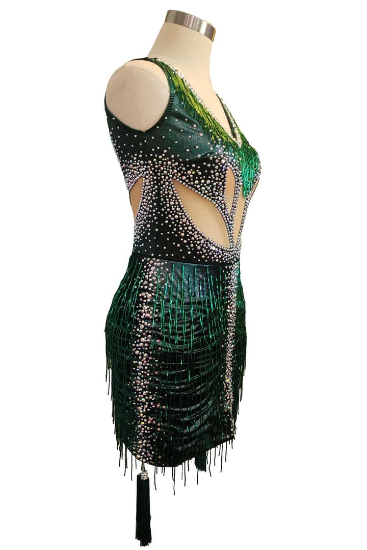 Side view of emerald green Latin dress with crystal embellishment and fringe