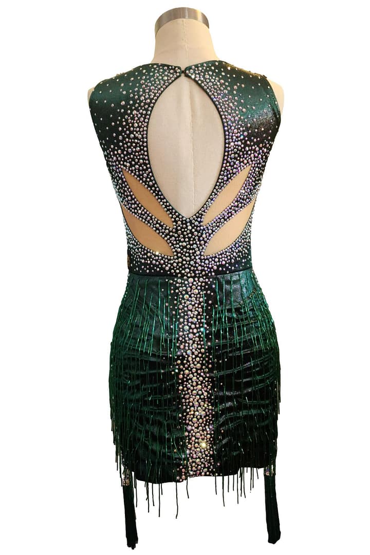 Back view of emerald green Latin dress with oval open back and crystal details