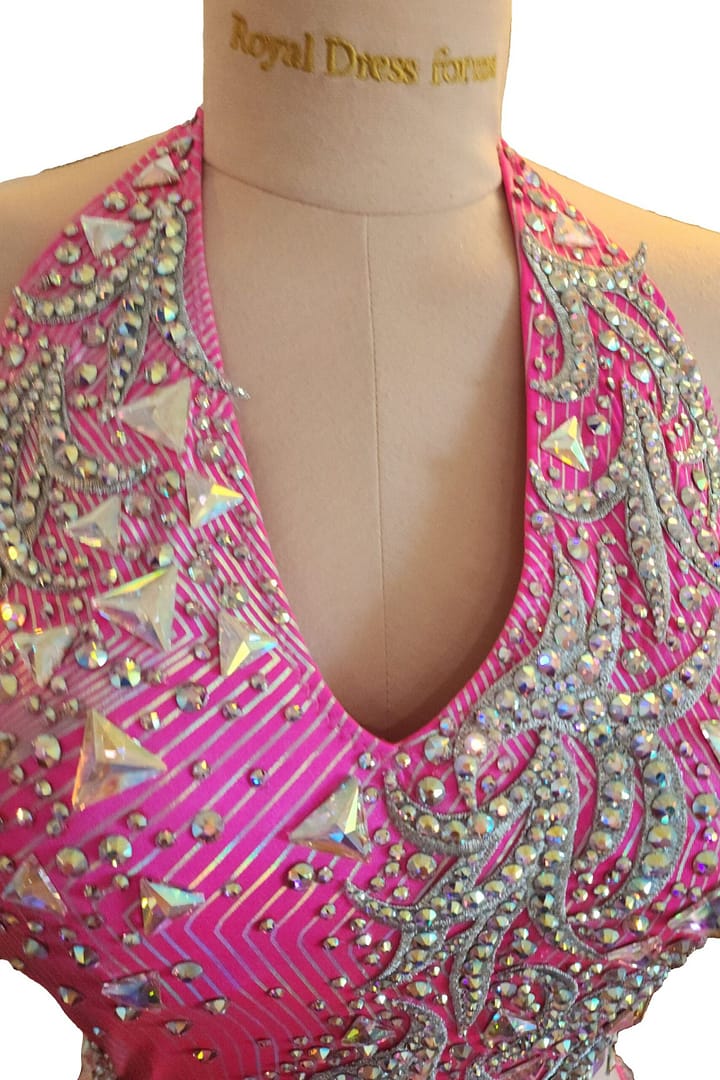 Neckline detail of halter Latin dress with crystal trim and geometric stones