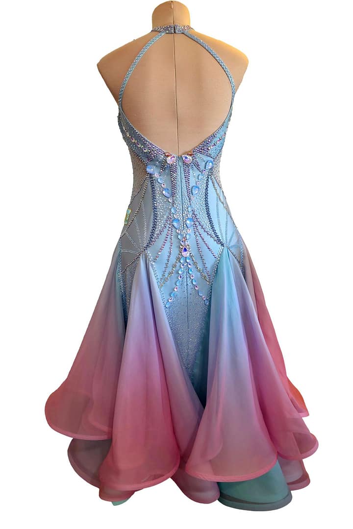 Back view of Serenity Bloom ballroom gown featuring open back halter design, crystal detailing, and layered chiffon skirt.