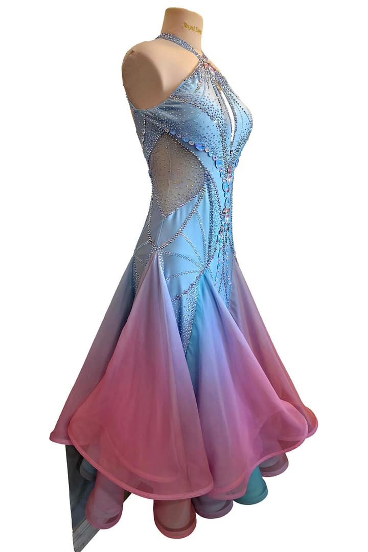 Detailed close-up of crystal stonework on ballroom gown featuring iridescent stones arranged in symmetrical patterns