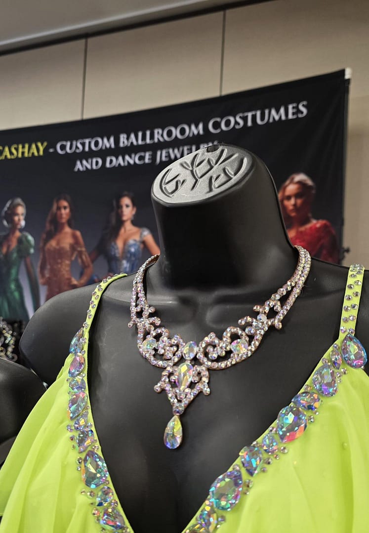 Crystal ballroom necklace worn on mannequin, highlighting neckline coverage and competition-ready design.