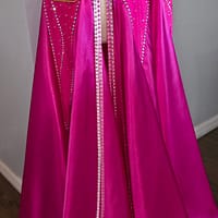 Detail of Malibu Dream ballroom gown skirt with satin fabric and crystal accents