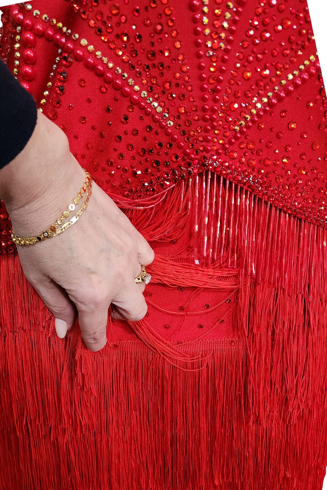Crimson Flame dress — skirt detail - close-up of thick red bead fringe showing the layered texture and depth of the beading.