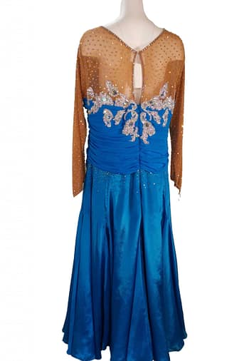 Paz Ballroom Dress – Back View — royal-blue ballroom gown with nude mesh back, keyhole opening, and crystal-covered appliques across the bodice.