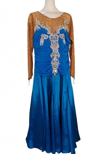 Paz Ballroom Dress – Front View — royal-blue ballroom gown with ruched bodice, nude mesh illusion neckline, and ornate silver appliques vertically placed down the front.