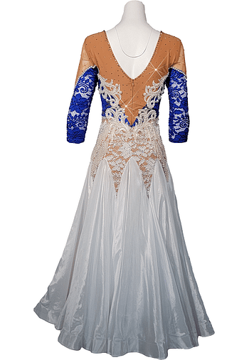 Back view of Blue Sonata ballroom dress with blue lace sleeves, nude mesh back, pearl embellishments, and flowing white ballroom skirt.