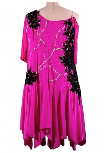 Edra Latin dress — back view — magenta with black lace appliqué, crystal detailing, and an off-shoulder sleeve